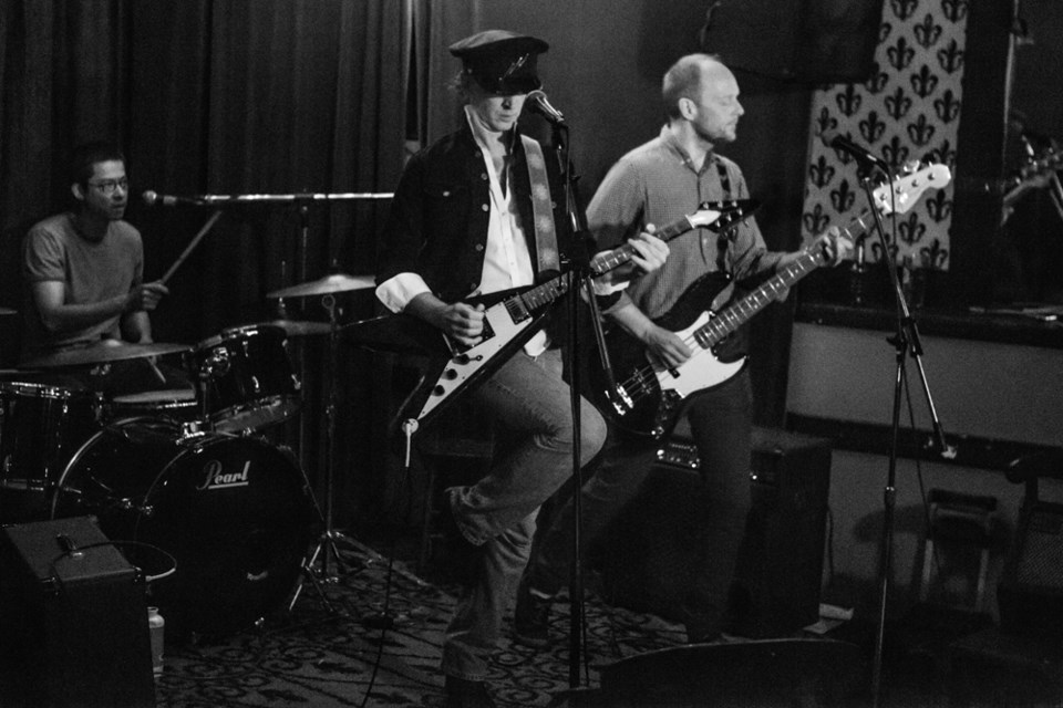 Polly performs live at LanaLou's in Vancouver in 2015 with Paul Leahy, middle, drummer Eric Lowe and bassist Eric Cottrell.