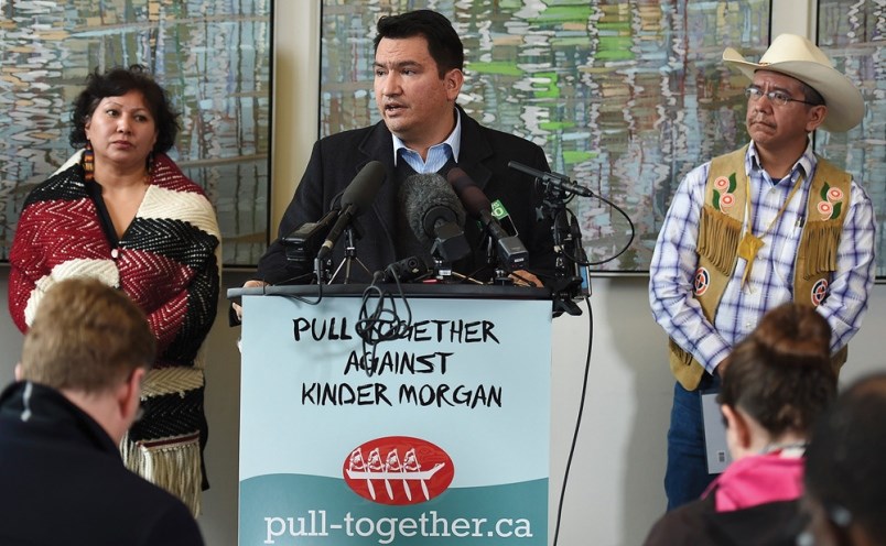 Squamish Nation Chief Ian Campbell, flanked by elected Tsleil-Waututh councillor Charlene Aleck and Coldwater Indian Band Chief Lee Spahan, addresses the media at a press conference in Vancouver on Tuesday morning.