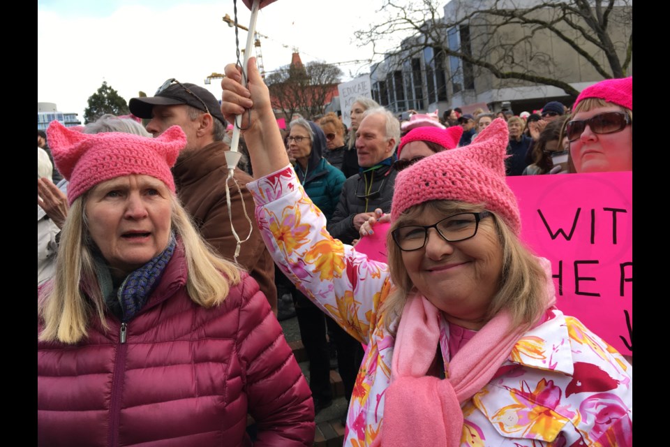 Retired teachers Carol Johnson and Becky Canterbury showing pink-hatted solidarity with the Women’s March on Washington. They joined 2,000 demonstrators in Centennial Square.