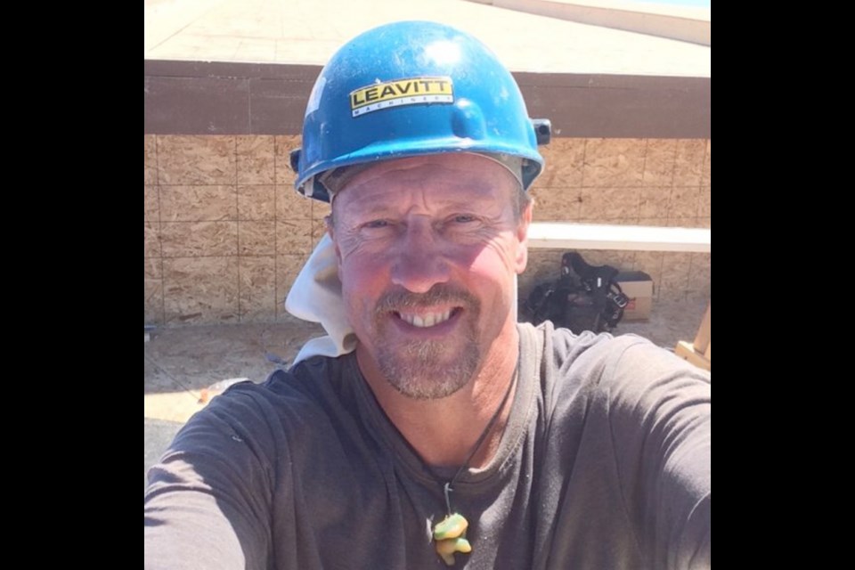 Construction worker Roland Huetzelmann died after he was struck by a piece of plywood lifted by a gust of wind and knocked off a third-floor construction site in Saanich.