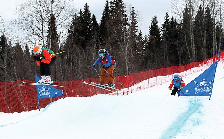 Isiah Francis leads Aiden Press and Zac Hoskins as they compete in an under-16 men's heat during the Western Canada Ski Cross Series event Sunday at Tabor Mountain.