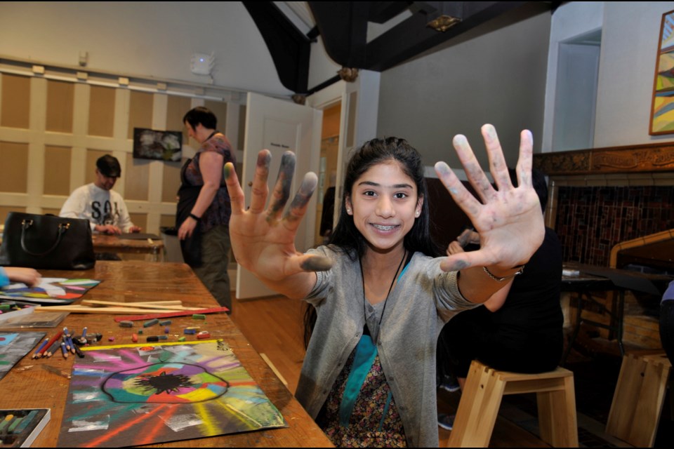 Priya Mann, 13, isn’t afraid to get her hands dirty in pursuit of her art during an In the BAG studio drop-in at Burnaby Art Gallery. The gallery is opening its doors to young artists over spring break with Spring Break Art Days.