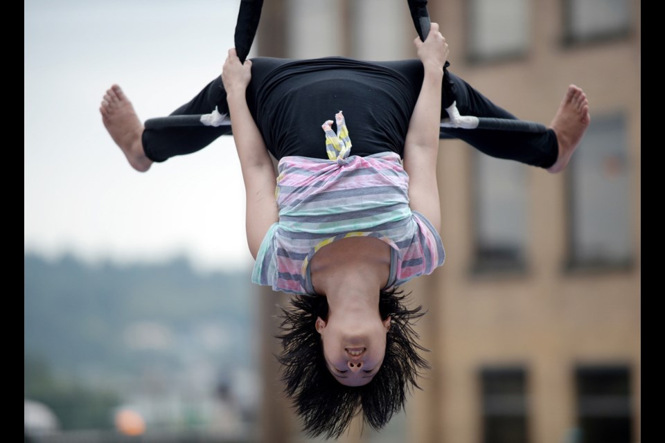 A Vancouver Circus School performer flies high during New West Pride last summer. Your kids and teens can learn circus skills at spring break camps at the circus school this March.