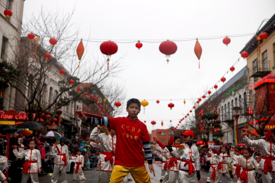 Hundreds of people celebrate the Year of the Fire Rooster on Fisgard Street in Victoria's Chinatown.