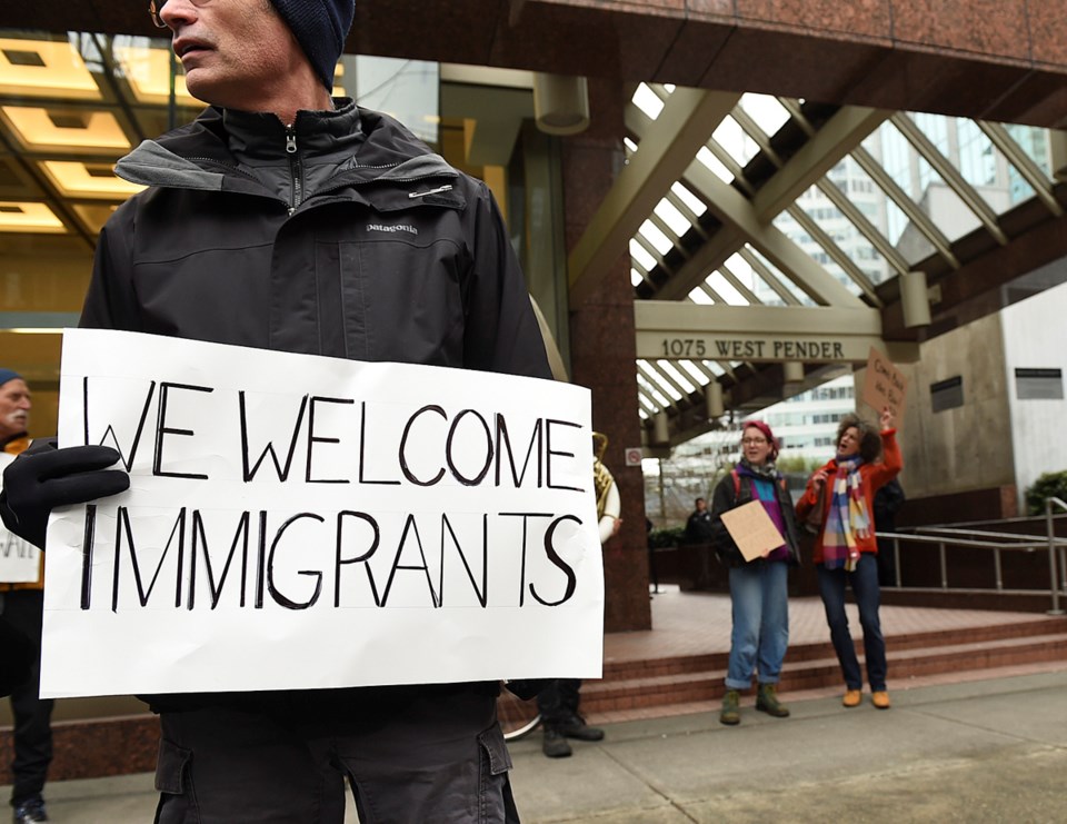 A small group of people protested U.S. president Donald Trump outside the U.S. Consulate General on