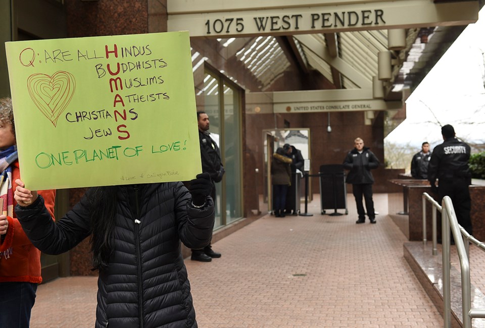 A small group of people protested U.S. president Donald Trump outside the U.S. Consulate General on