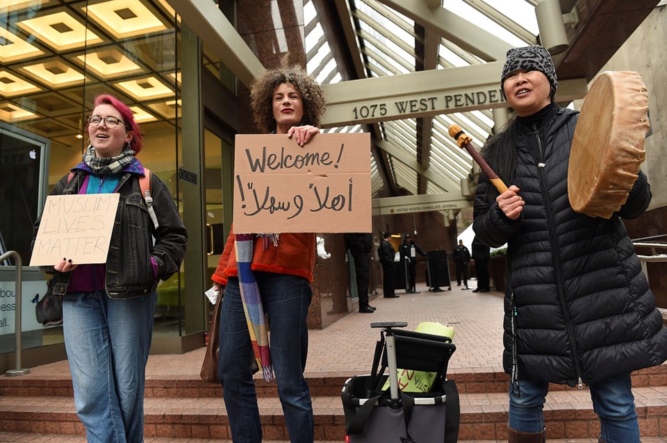 A small group of people protested U.S. president Donald Trump outside the U.S. Consulate General on