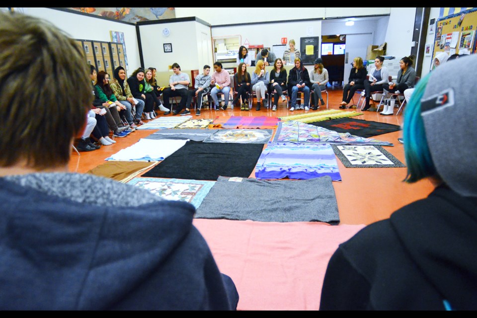 Students gather in a circle before the blanket exercise gets underway. Purpose Secondary School organized the ceremony to share with students the history of the First Nations people in Canada and the relationship between the indigenous and non-indigenous populations.
