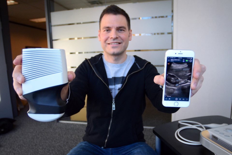 Clarius Mobile Health founder and CEO Laurent Pelissier holds one of his Burnaby-based company’s C3 handheld ultrasound scanners, which won Health Canada and U.S. Food and Drug Administration approval in December for use by medical professionals.