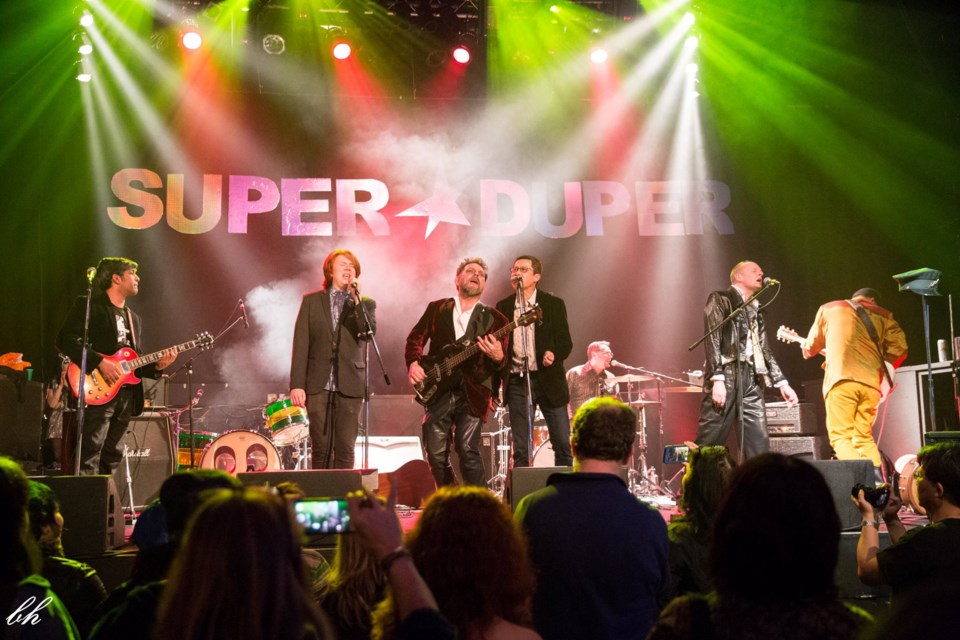 Paul Leahy, a New Westminster musician who died of cancer last week, was honoured at a tribute concert in Vancouver last Friday. His 20-year-old son, Finn, second from left, was among the performers.