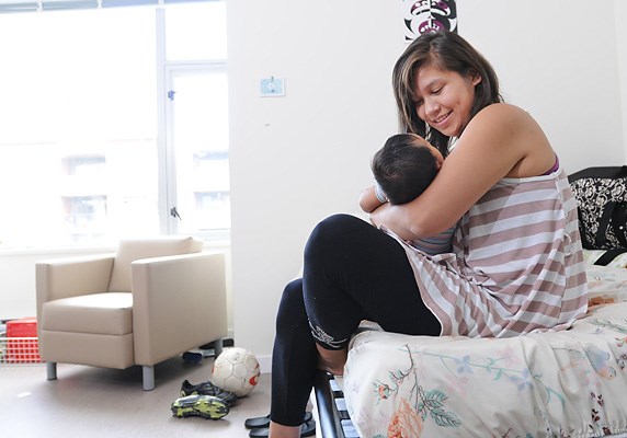 Tiah Seward, here with her infant son Virgil, found social support with the soccer team that then led to her getting into a Station Street housing complex.