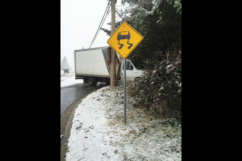 A truck was lodged against a hydro pole on School Road and North Fletcher in Gibsons due to icy conditions on Friday, Feb. 3.