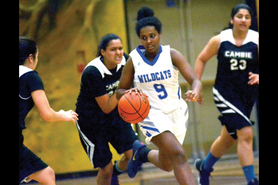 McMath Wildcats' Martha Melaku heads up the floor during her team's 69-47 win over the Cambie Crusaders Wednesday in the Richmond Senior Girls Basketball League championship game. It was McMath's fourth straight title.