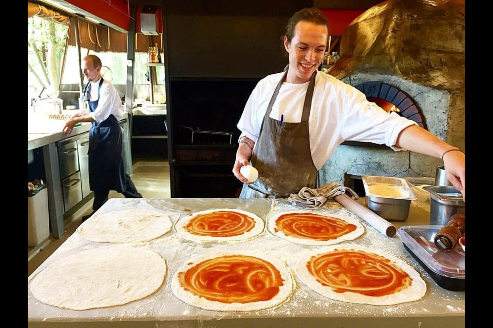Hunter Blackburn prepares pizza for staff at restaurant As in Amsterdam. The New West native is learning new culinary skills at the restaurant and is planning to open his own restaurant in Vancouver in the future.