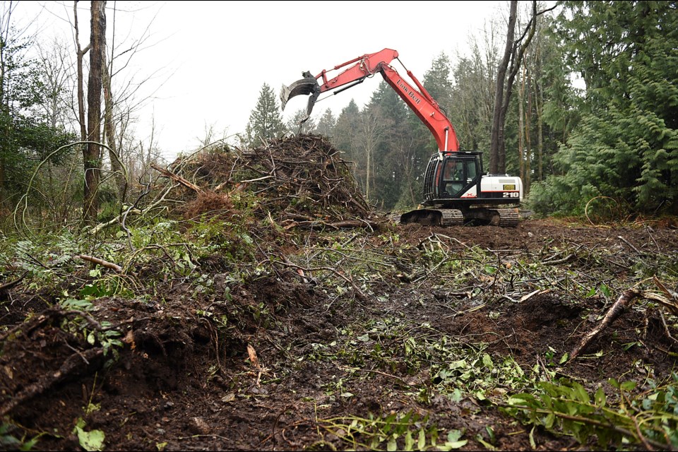 A backhoe and construction crews began work Wednesday on the Musqueam Indian Band’s residential development on its property near the University of B.C. Photo Dan Toulgoet