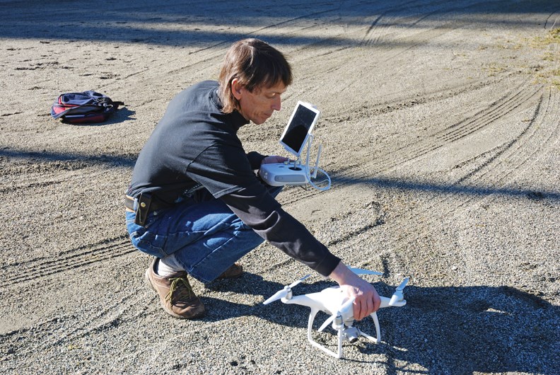 Kevin Cafferky prepares the drone for a demonstration flight at Cliff Gilker Park.