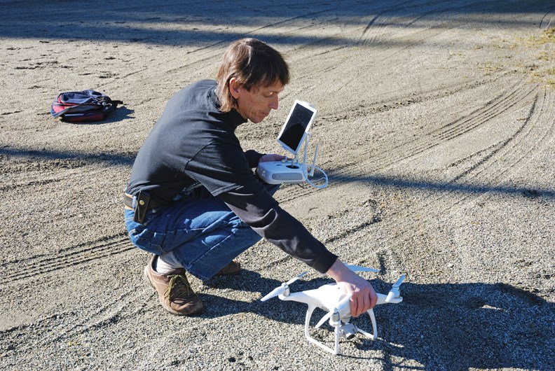 Kevin Cafferky prepares the drone for a demonstration flight at Cliff Gilker Park.