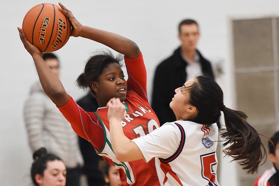 Britannia's Surprise Munie (no. 10) keeps the ball in her control on the way to the senior girls city championship over the Churchill Bulldogs at Hamber secondary Feb. 9, 2017. Photo Dan Toulgoet