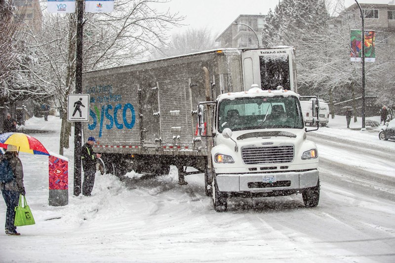 A stranded semi truck sits on Lonsdale Avenue during a huge dump of snow Feb. 3 that turned the steep thoroughfare into a slippery, icy mess. Active North Vancouver photo bug Mark Teasedale found himself in the middle of the action when his SUV got stuck along with everyone else on the road. photo Mark Teasedale