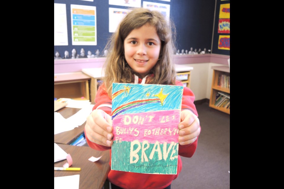 Westwind elementary Grade 4 student Jessica Osten, 9, shows off one of her special Pink Shirt Day comic cards that she’s created as part of the class’s Comic Con project. Members of teacher Carlos Victoria’s Grade 4/5 combined class created their comics and anti-bullying cards as part of their Comic Con, which ticks many of the year’s curriculum boxes. Photos by Alan Campbell/Richmond News
