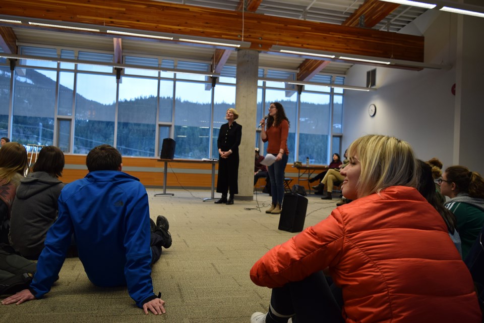 Students listen Mari Piggott, of Quest’s Students' Representative Council, while lawyer Kim Hart looks on at a community meeting at the university Feb. 14 that discussed the development of Quest’s sexual misconduct policy.