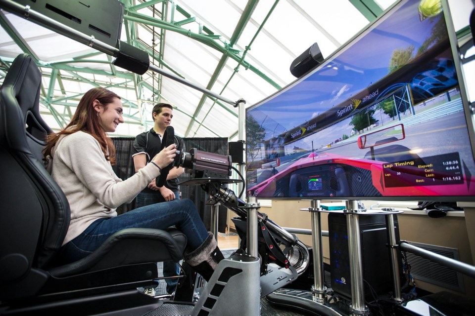 Mya Sage was one of many Discover Tectoria visitors who got to try advanced racing simulators courtesy of Sidney-based VRX Ventures.