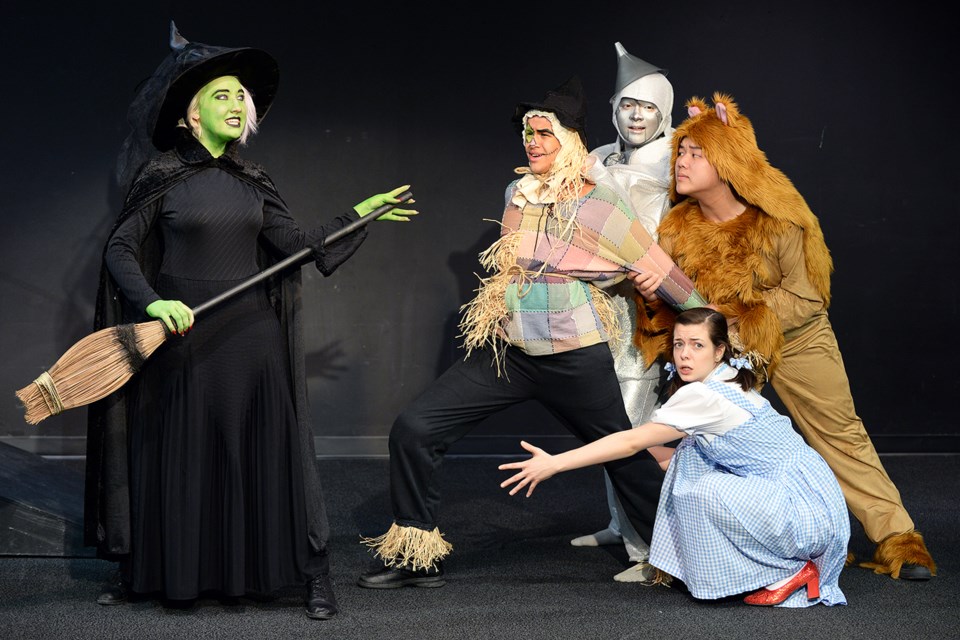 Abigail Barclay as the Wicked Witch is out to get Imogen O'Neal as Dorothy, Hemanshu Dave as Scarecrow, Ethan Radano as Tin Man and Andy Nie as Lion in the Burnaby Mountain Secondary production of The Wizard of Oz.