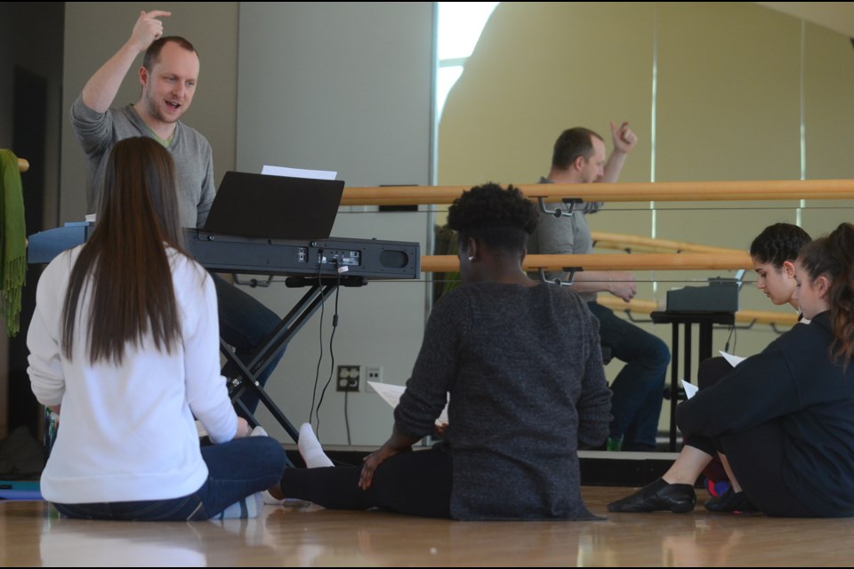 Peter Jorgensen, at keyboard, works with (from left) Olivia Fryer, a Grade 10 NWSS student; Jane Dut, a Grade 12 NWSS student; Sasha Novosiltseff, a Grade 9 NWSS student; and Sofia Slater, a Grade 11 student at Heritage Woods Secondary in Port Moody, during a Pro-D Day workshop at Anvil Centre.