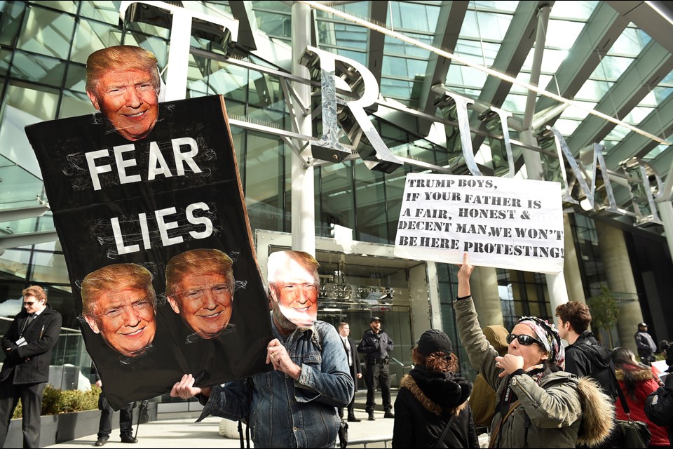 Protesters demonstrated outside Trump Vancouver Tuesday while members of the Trump family celebrated its official opening inside. Photo Dan Toulgoet