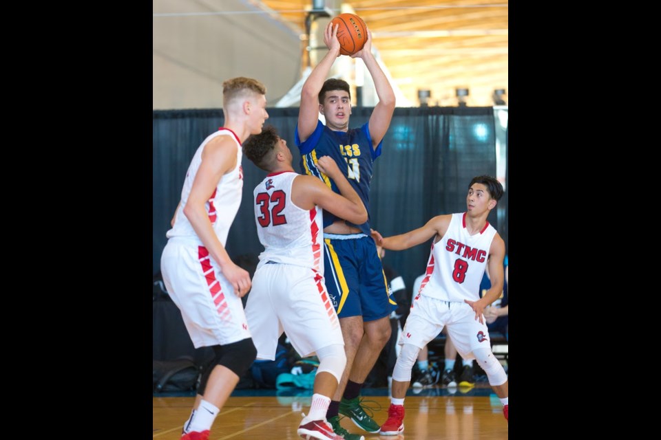 Shown defending against the Lower Mainland championship's eventual MVP Fardaws Aimaq of Steveston-London, STM's Cam Morris, Sajjun Shokar and E.j. Escobedo provided key leadership en route to the team's third place finish.