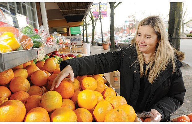 Claudia Laroye, executive director of the Marpole Business Association, shops along Granville Street.