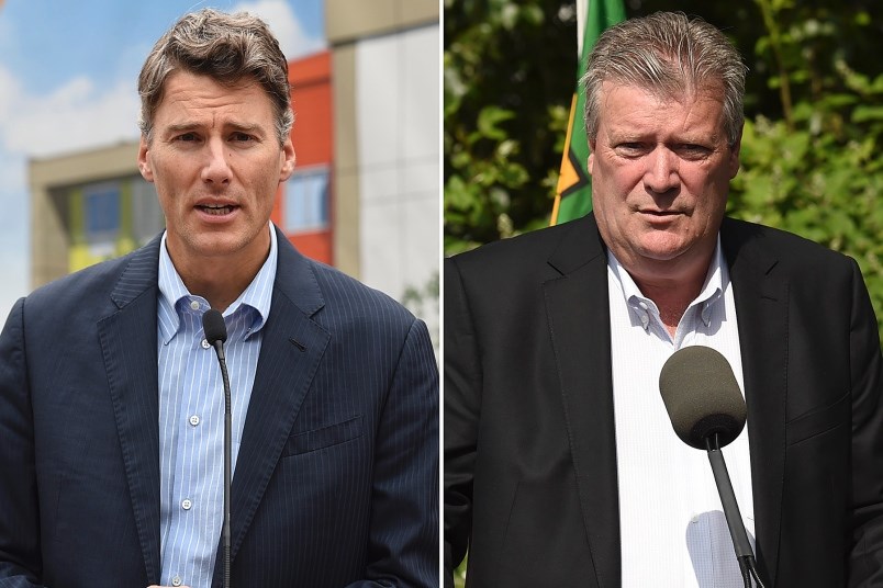 Mayor Gregor Robertson and Housing Minister Rich Coleman are battling again over which government could do more to get people off the street and into homes. Photos Dan Toulgoet