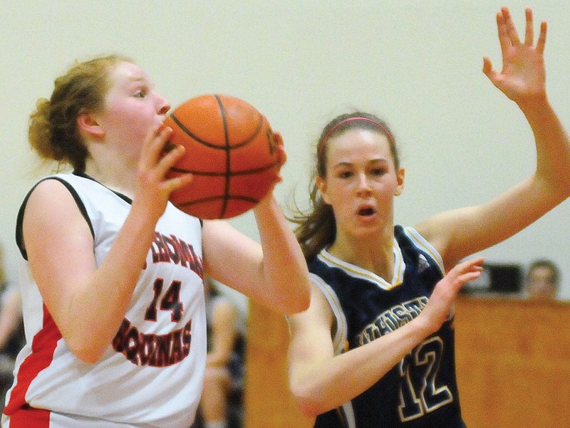 Rebecca Clarke muscles her way to the basket for the STA Fighting Saints. Clarke helped lead the Saints to the junior girls provincial title Saturday in Langley. photo Cindy Goodman, North Shore News
