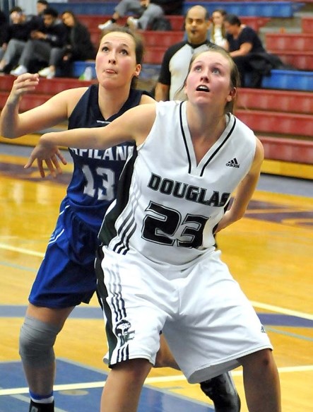 Douglas College’s Rachel Beauchamp, front, holds off Capilano’s Amber Kavanagh during recent league action. The two teams met in the provincial final, where the Royals prevailed 70-63.
