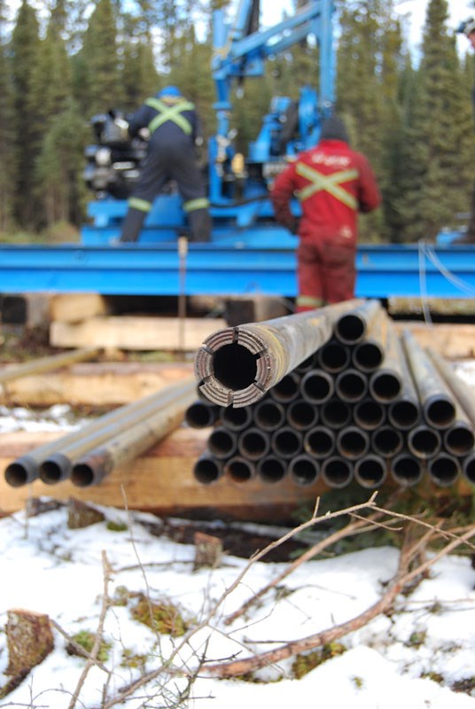Diamond drill bit, core barrel, and drillers on a 2010 east side of Wekusko drill project .