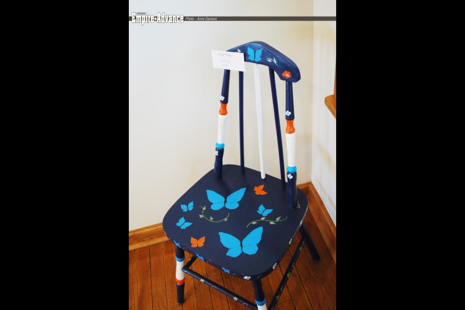 “Sitting Pretty” chair painted in acrylic by Lynda Lyng.