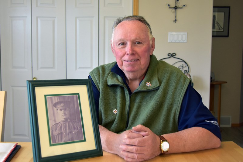 Rupert Klyne with a photo of his great-uncle, World War I Private Reginald Johnston, whose remains w