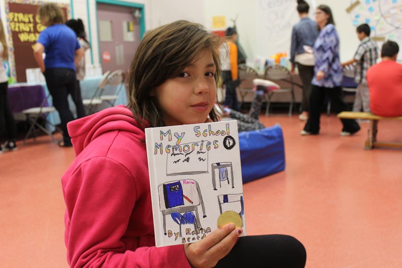 Raina Beardy, a Grade 5 student at Juniper School, shows off her entry for this year’s writers’ symp