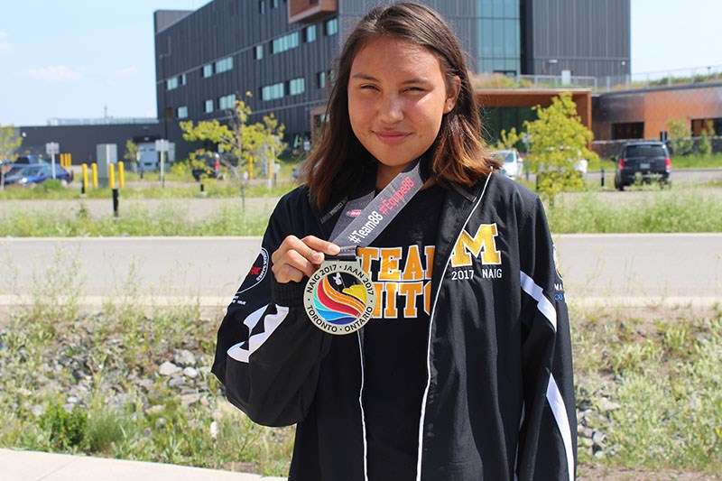 Breeann Pagee shows off the gold medal in high jump she won at the 2017 North American Indigenous Games, which took place July 16–23 in Toronto.