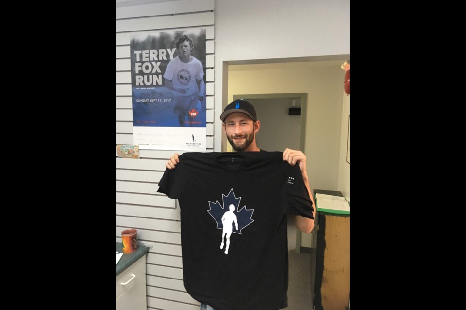 CHTM radio host Josh Cain displays the t-shirts that are on sale for this year’s Terry Fox Run in Thompson. Photo courtesy of Josh Cain.