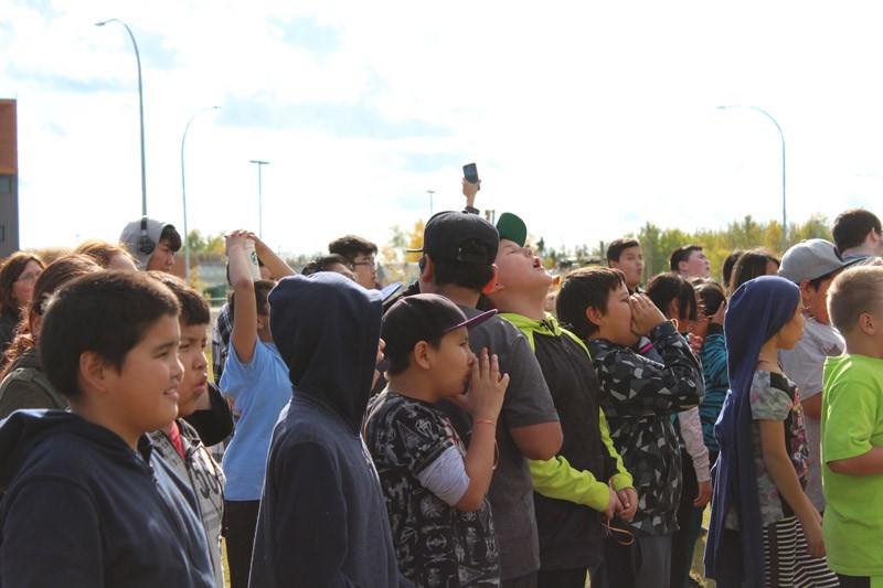 Over 2,000 Thompsonites gathered at Red Sangster Ball Field near the Thompson Regional Community Centre on Sept. 21 to break the world record for group wolf howling. Photograph by Kyle Darbyson.