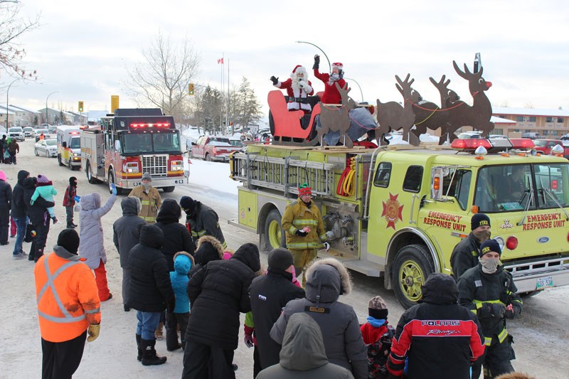 Mr. and Mrs. Claus get a ride courtesy of Thompson Fire & Emergency Services during Saturday’s parade.