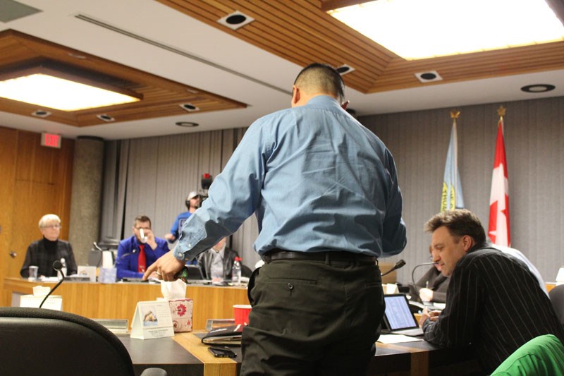 Duncan Wong gets up to leave council chambers Dec 11 after butting heads with Mayor Dennis Fenske