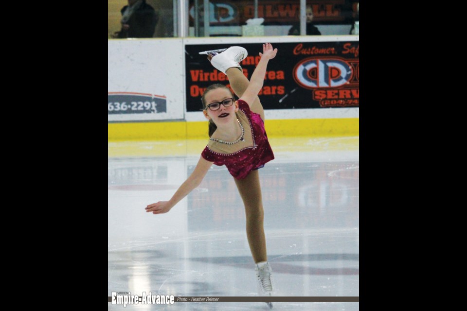 Megan Dryden of Skate Virden gets great height with her spiral in the Star 4 Free Program.