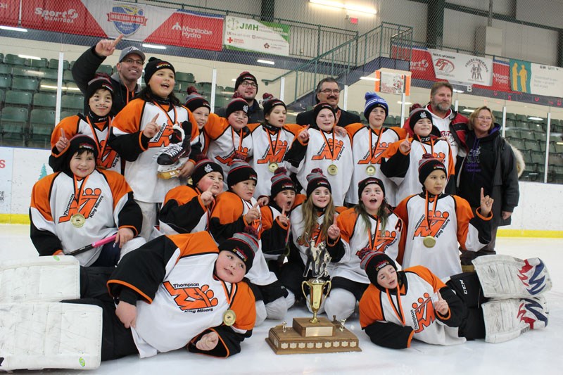The peewee A King Miners pose for a photo with the Prince-Berscheid Cup after beating the Tataskweya