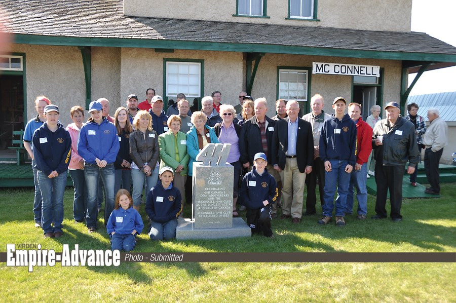 Kim McConnell (front second right) with past and present members of the McConnell 4-H Beef Club in 2013. The club is being recognized as the longest serving 4-H Club in Canada. In honor of that occasion, McConnell donated the cairn that sits in front of the McConnell Railway Station, now a museum in Hamiota.