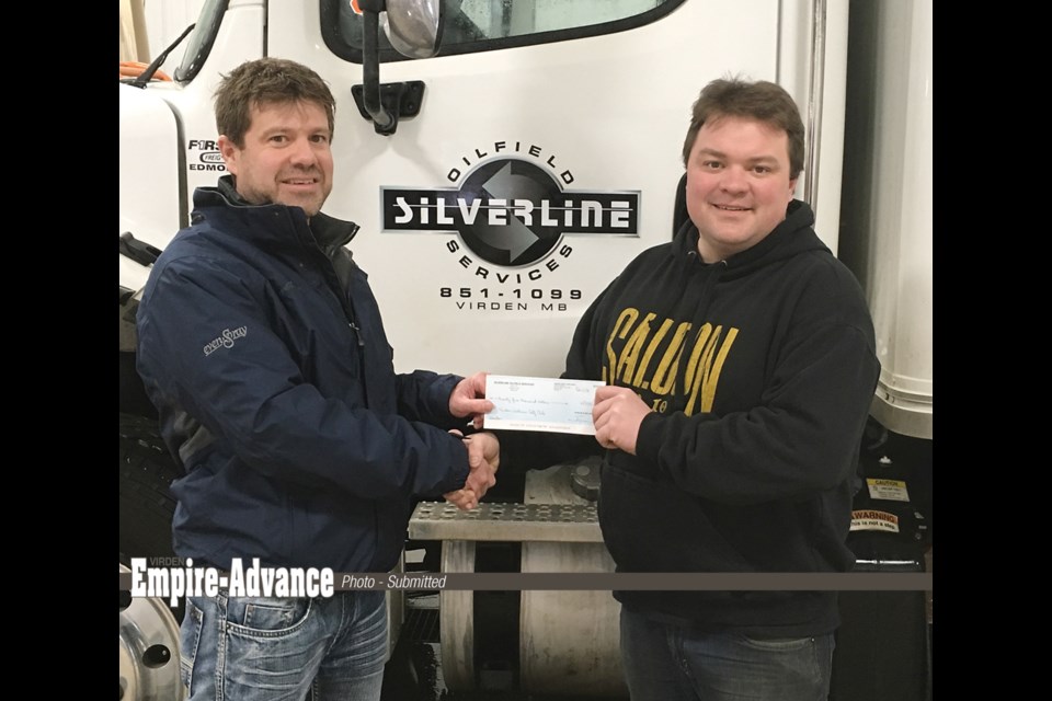 Virden Wellview Golf Course Superintendent Jason Routledge (l) accepts a cheque on behalf of the golf course for $25,000 from Terry Law, owner of Silverline Oilfield Services.