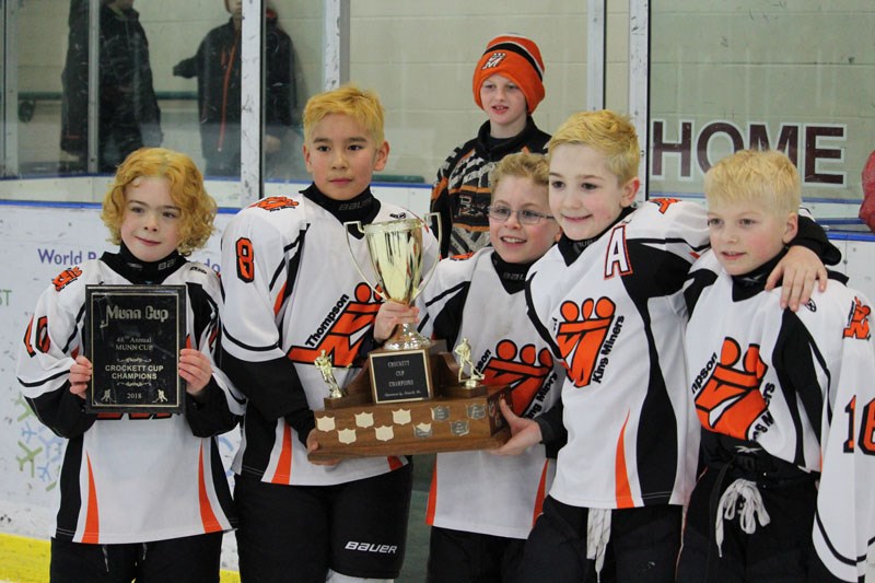 Team captains for the atom A Thompson King Miners brandish the Crockett Cup after beating the Swan R