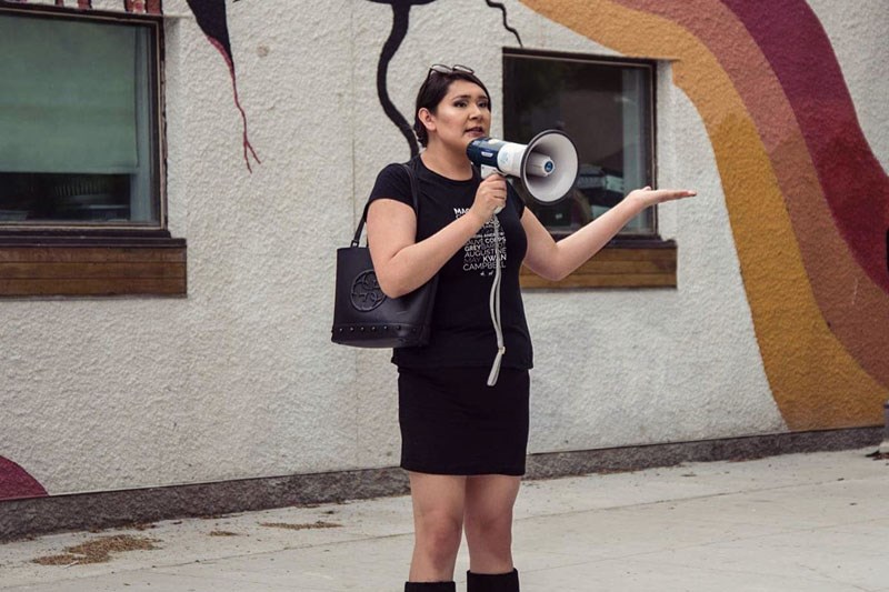 Brielle Beardy-Linklater brandishes a megaphone during the Meet Me at the Bell Tower event in Winnip