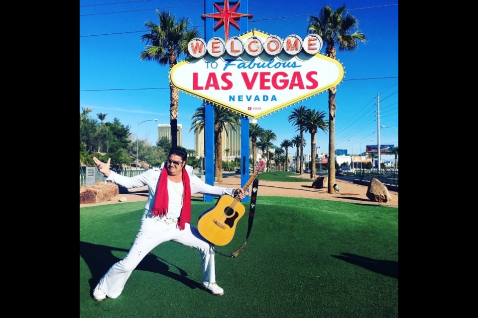 Take a selfie with minister and Elvis tribute artists Mark Rumpler at the Welcome to Fabulous Las Vegas sign.